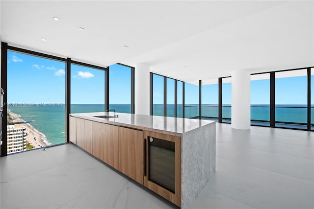 kitchen featuring expansive windows and a water view