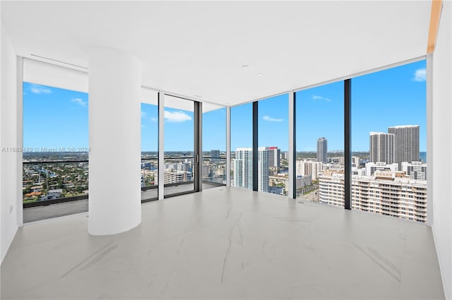 empty room featuring floor to ceiling windows