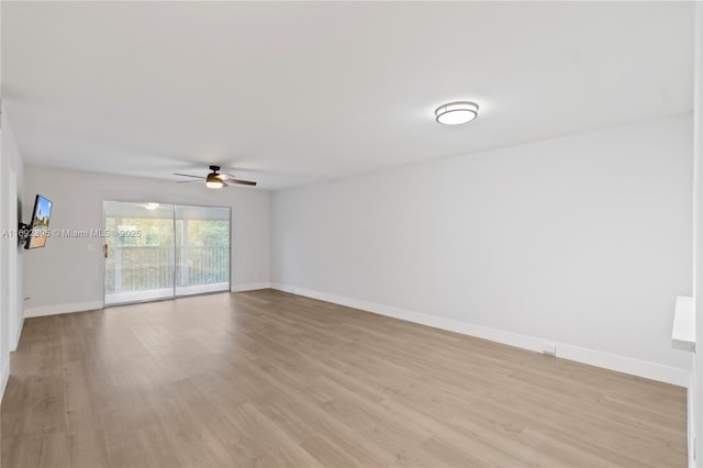 spare room featuring light wood-type flooring and ceiling fan