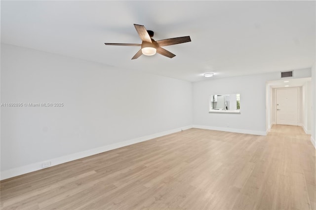 empty room featuring ceiling fan and light hardwood / wood-style floors