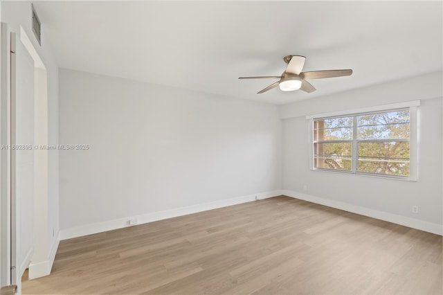 unfurnished room featuring ceiling fan and light hardwood / wood-style floors