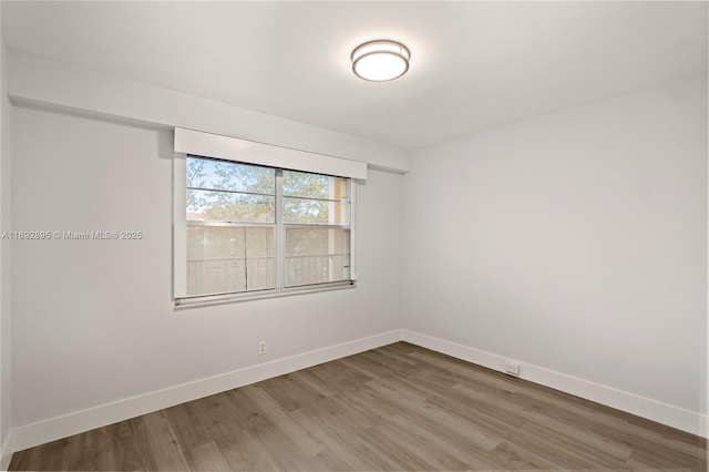 spare room featuring hardwood / wood-style floors