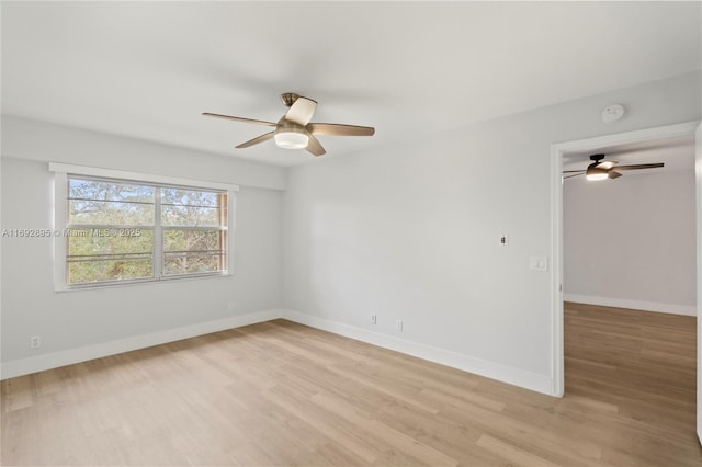 unfurnished room featuring ceiling fan and light hardwood / wood-style flooring