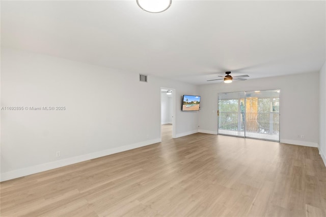 spare room with light hardwood / wood-style flooring and ceiling fan