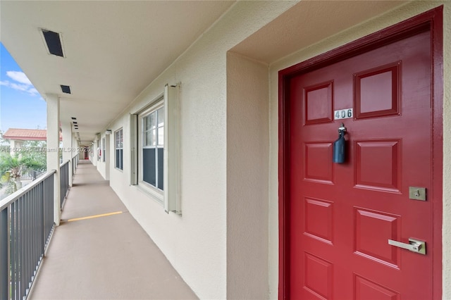 property entrance with a balcony