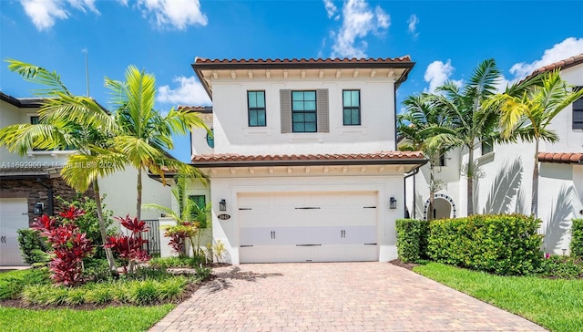 mediterranean / spanish-style home featuring a garage