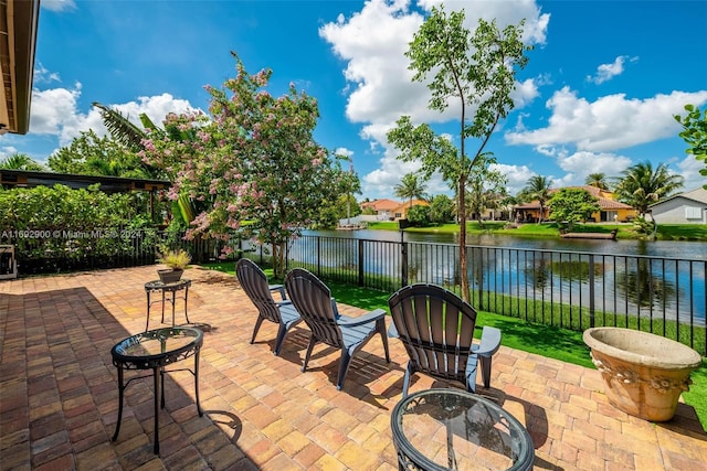 view of patio / terrace featuring a fire pit and a water view