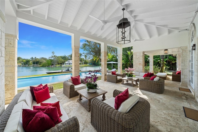 view of patio / terrace featuring an outdoor hangout area, ceiling fan, and a water view