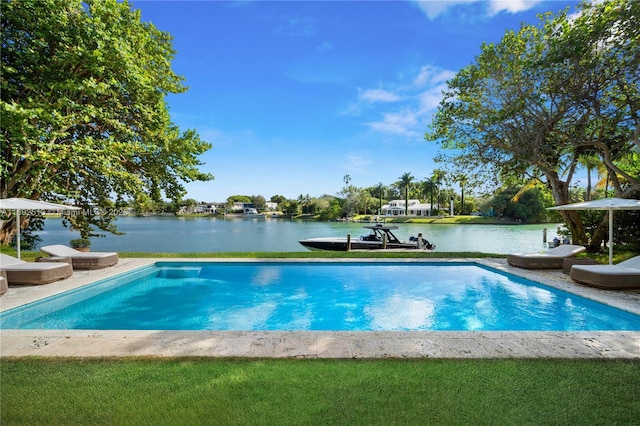 view of swimming pool with a water view