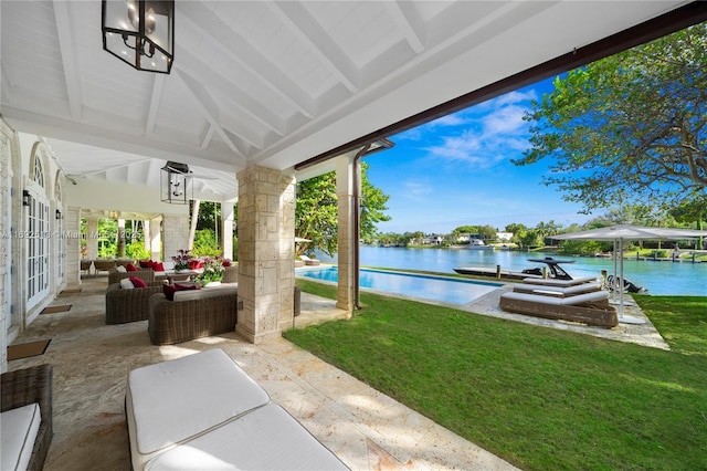 view of patio / terrace with a water view, outdoor lounge area, a boat dock, and french doors