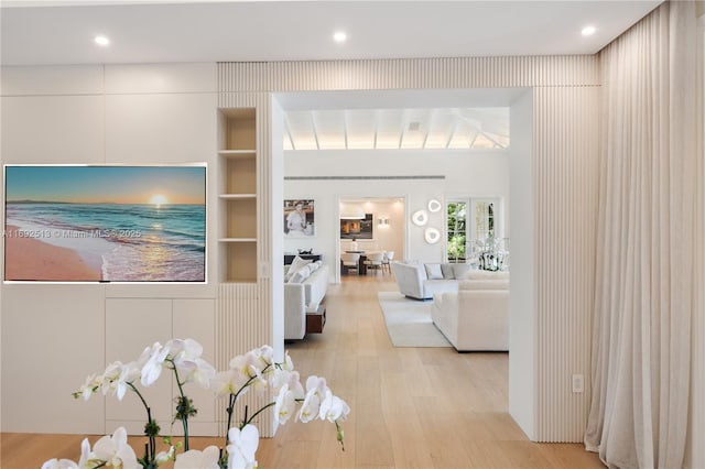 interior space featuring built in features and light wood-type flooring