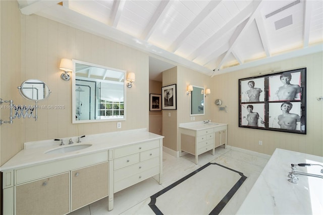 bathroom with vanity and vaulted ceiling with beams