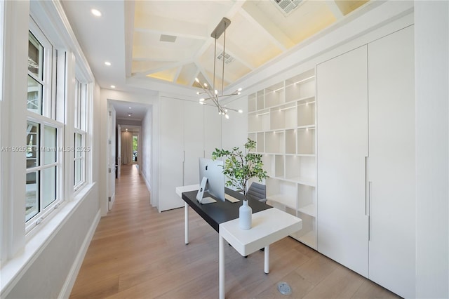 hall featuring a notable chandelier, beamed ceiling, and light wood-type flooring