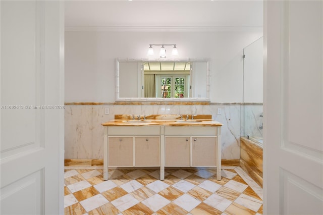 bathroom featuring walk in shower, ornamental molding, vanity, and tile walls