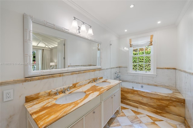 bathroom with ornamental molding, vanity, and tiled tub