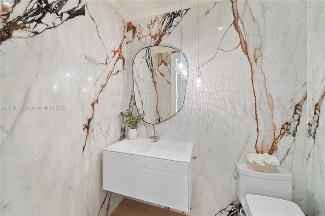 bathroom with vanity and toilet