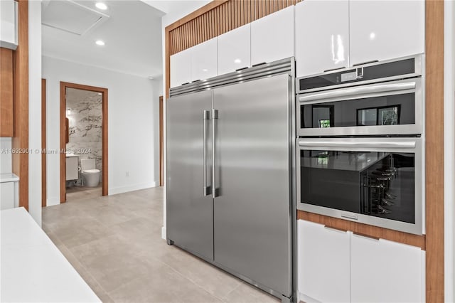 kitchen featuring white cabinets and stainless steel appliances