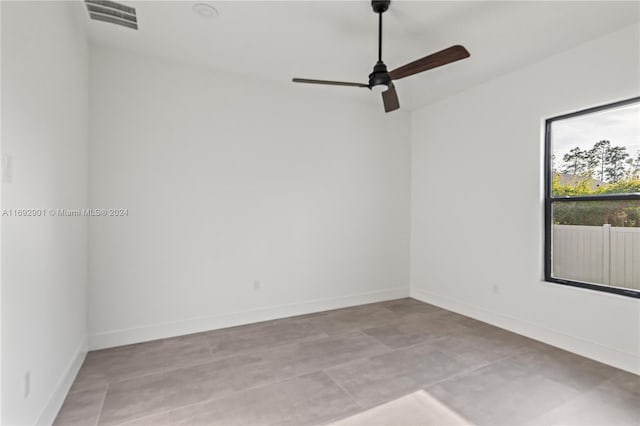 spare room with ceiling fan