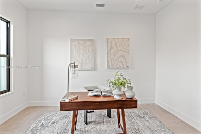 office space featuring light tile patterned flooring