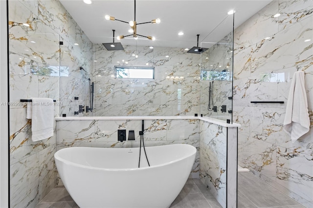 bathroom featuring separate shower and tub and tile walls