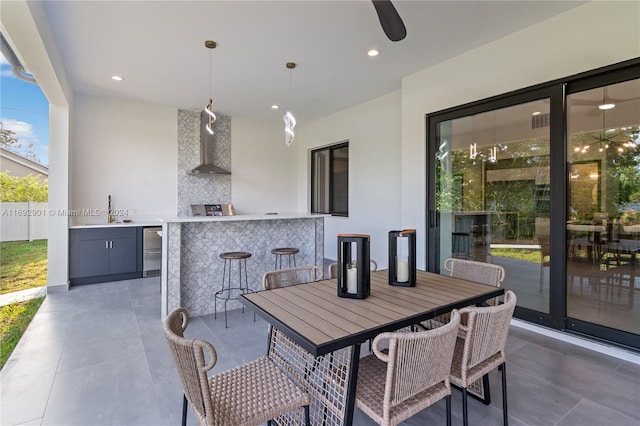 view of patio / terrace with ceiling fan and a wet bar