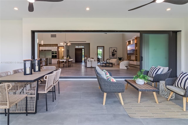 view of patio featuring outdoor lounge area and ceiling fan