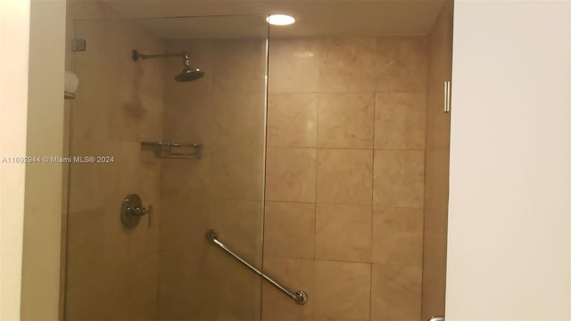 bathroom with tiled shower