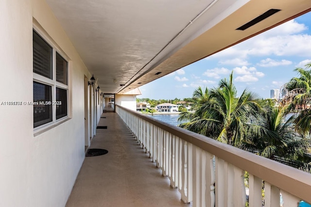 balcony featuring a water view