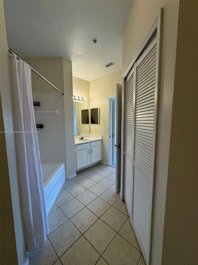 8239 Claire Ann Dr Unit 307, Orlando, FL 32825 - bathroom featuring shower / bath combination with curtain, tile patterned floors, and vanity