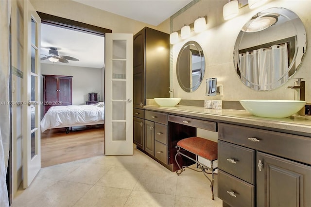 bathroom with ceiling fan, vanity, french doors, and tile patterned floors