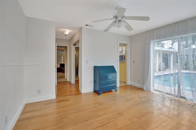 unfurnished room featuring ceiling fan and light hardwood / wood-style floors