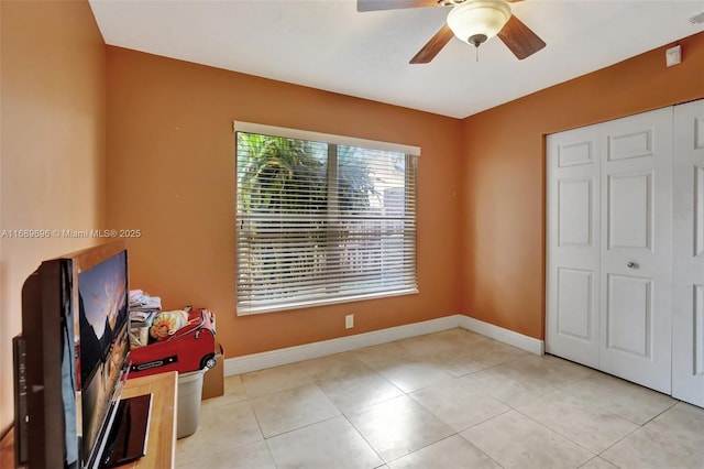 interior space featuring ceiling fan