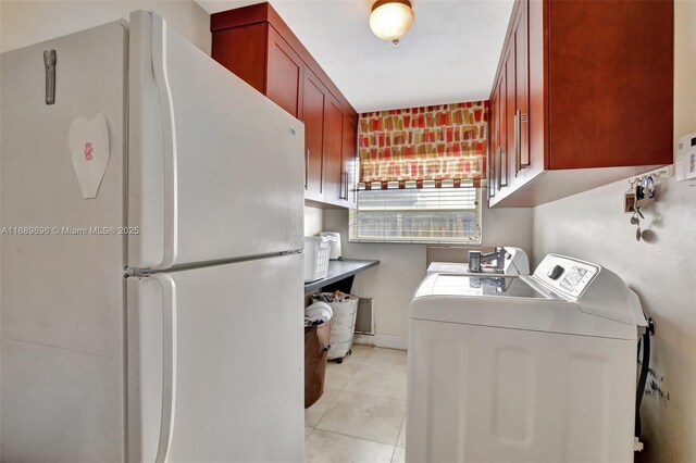 washroom featuring light tile patterned flooring and independent washer and dryer