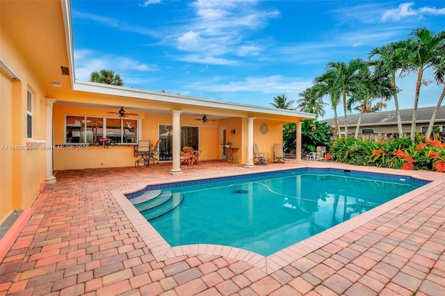 view of pool with ceiling fan and a patio area