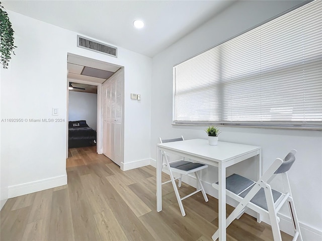 dining area with light wood-type flooring