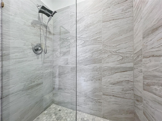 bathroom with tiled shower