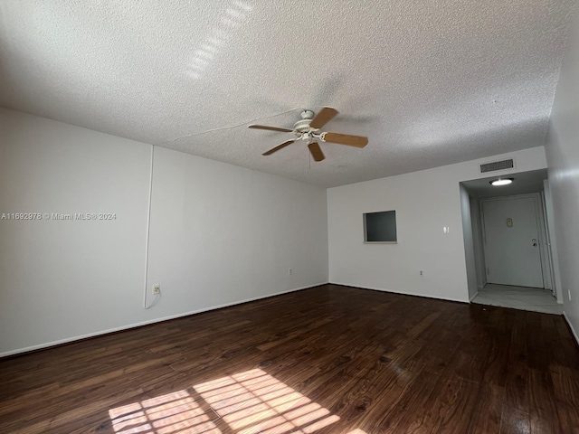 unfurnished room with a textured ceiling, hardwood / wood-style flooring, and ceiling fan