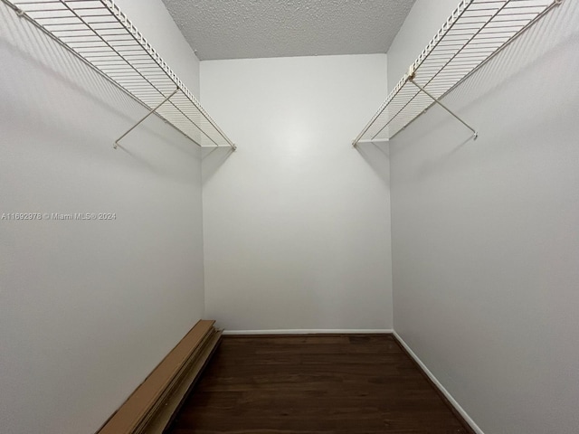 4344 NW 9th Ave Unit 9-3D, Deerfield Beach, FL 33064 - spacious closet featuring wood finished floors