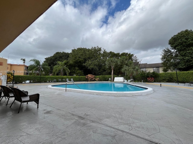 4344 NW 9th Ave Unit 9-3D, Deerfield Beach, FL 33064 - community pool with a patio area