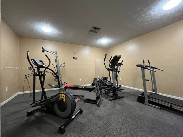 exercise area with a textured ceiling