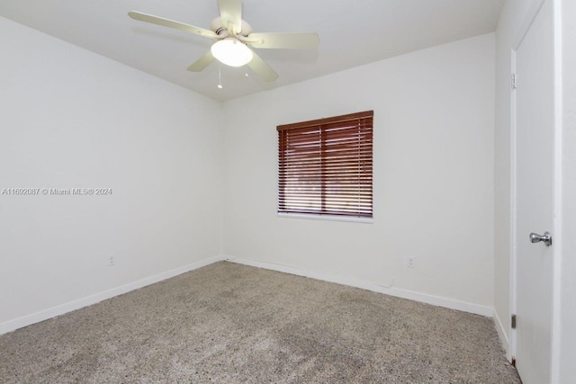 empty room featuring ceiling fan and carpet flooring