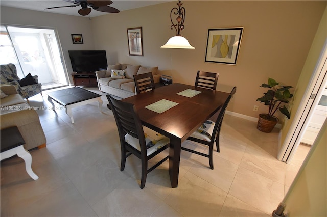 dining area featuring ceiling fan and light tile patterned flooring