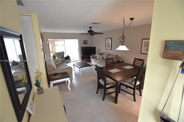 2688 E Dudley Dr Unit H, West Palm Beach, FL 33415 - dining space with a ceiling fan and a textured ceiling