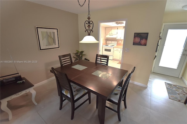 2688 E Dudley Dr Unit H, West Palm Beach, FL 33415 - dining area with baseboards and light tile patterned flooring