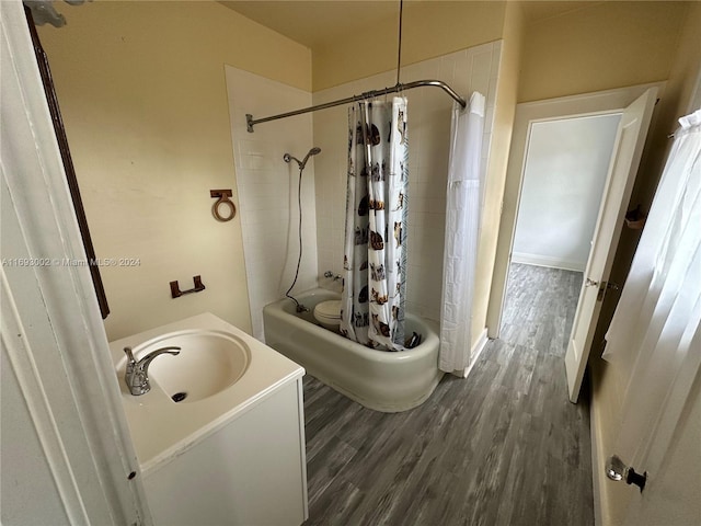 bathroom with vanity, wood-type flooring, and shower / bathtub combination with curtain