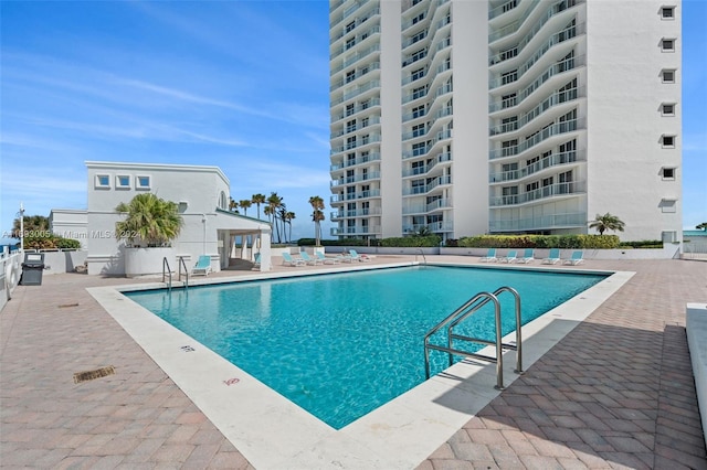 view of swimming pool featuring a patio area