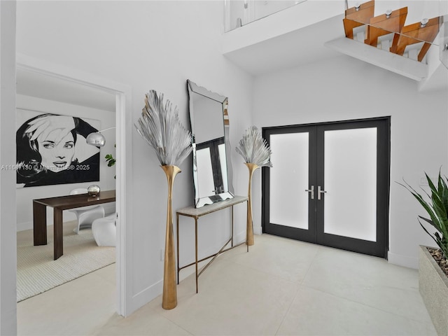 2000 S Bayshore Dr Unit 4, Coconut Grove, FL 33133 - entrance foyer featuring french doors, a towering ceiling, and baseboards