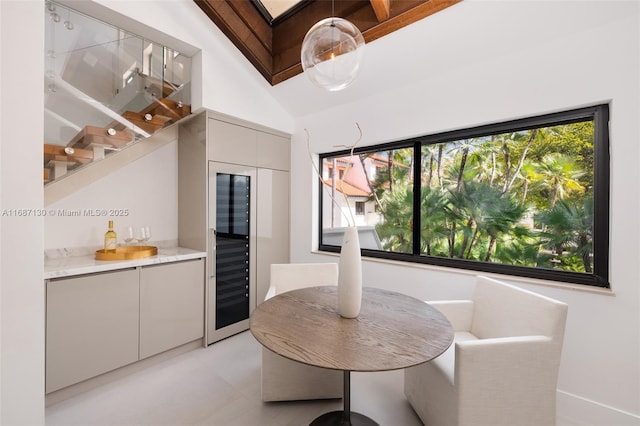 2000 S Bayshore Dr Unit 4, Coconut Grove, FL 33133 - dining room featuring a dry bar, healthy amount of natural light, and wine cooler