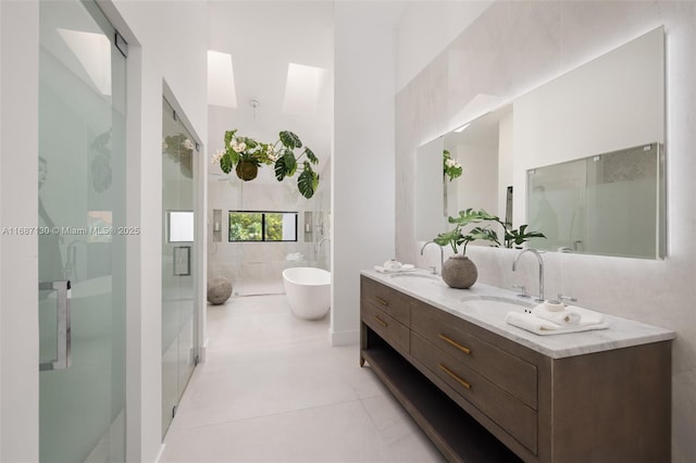 2000 S Bayshore Dr Unit 4, Coconut Grove, FL 33133 - bathroom with a stall shower, a soaking tub, double vanity, tile patterned floors, and tile walls