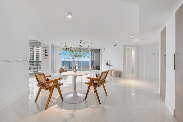 dining area featuring a water view